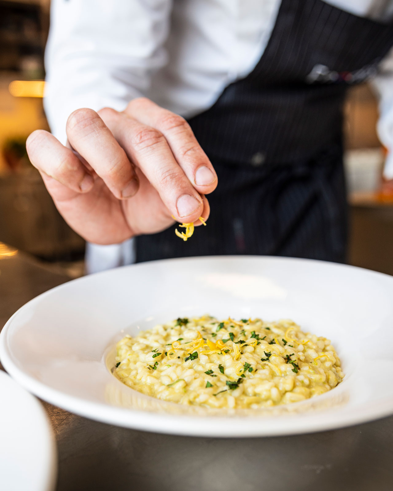 Immagine che mostra un piatto di risotto servito al Club House Restaurant di Villa Sant'Uberto